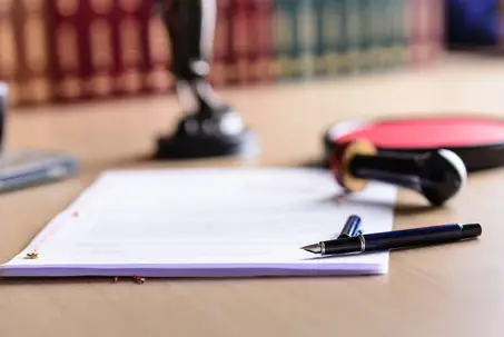 Contract waiting for a notary public sign on desk. Notary public accessories