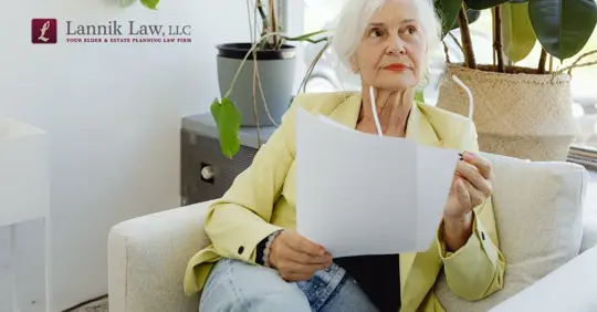 old woman with a document